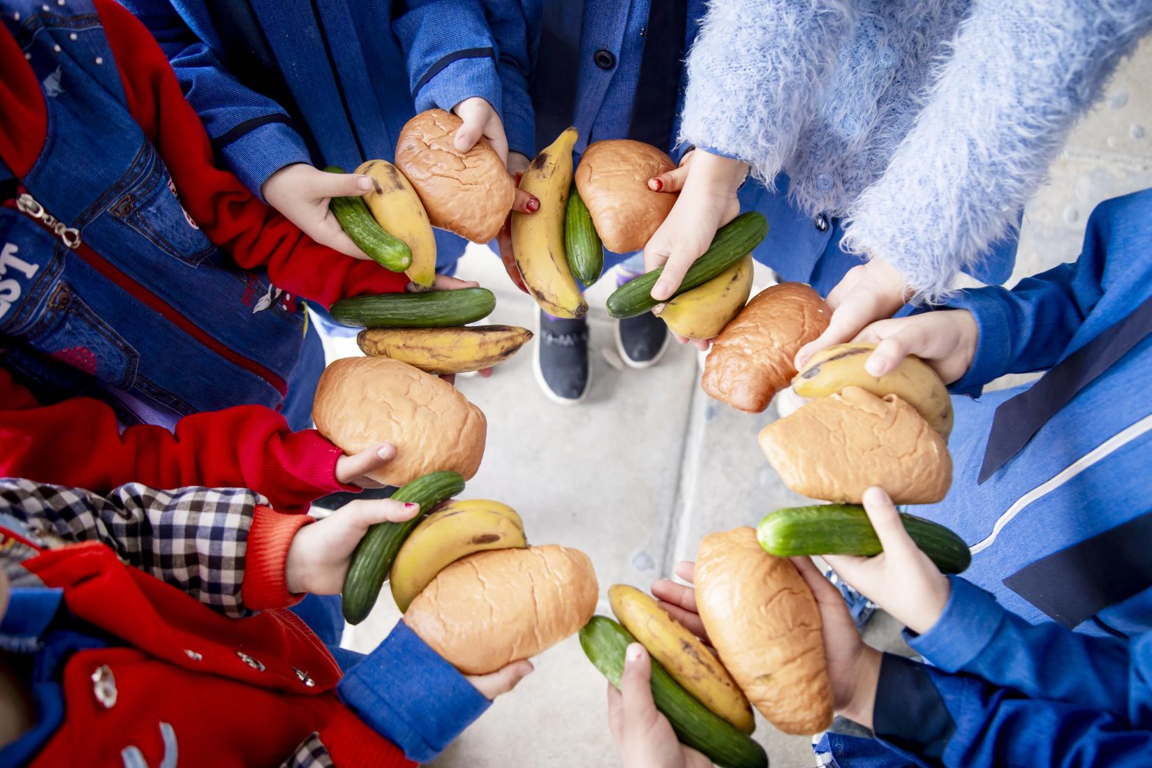 A group of fourth graders presenting their school meal.